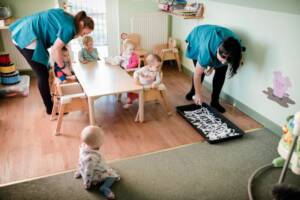 Babies messy play session in a nursery