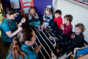 Group of children singing in a day nursery